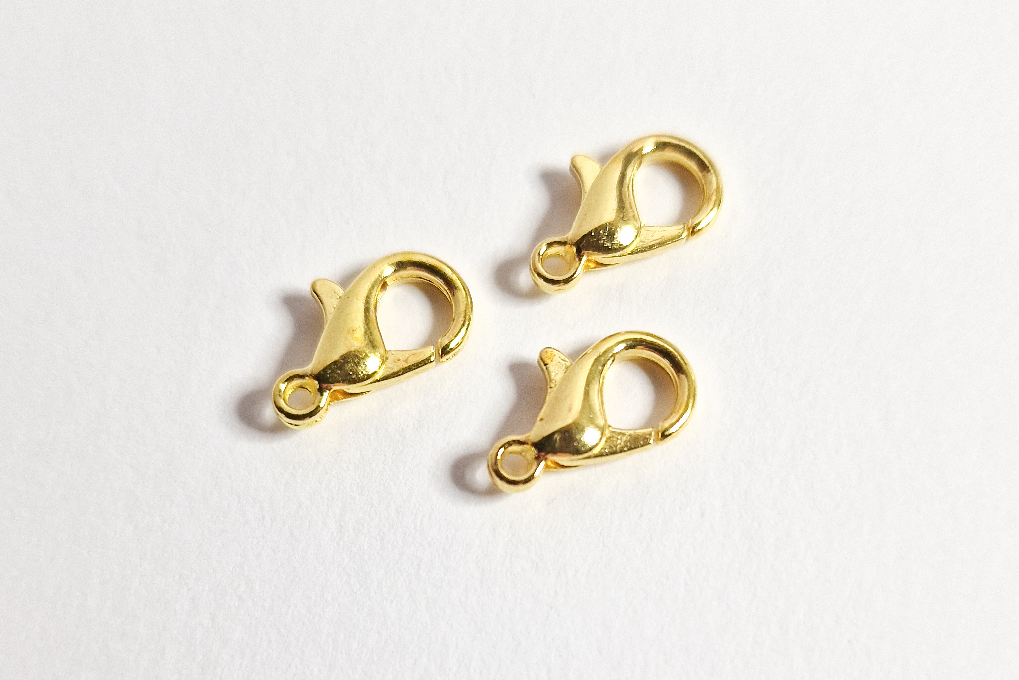 Låser, gullfarget, 12mm, 10pk