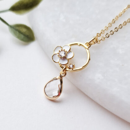 18k gullforgylt smykke med blomst